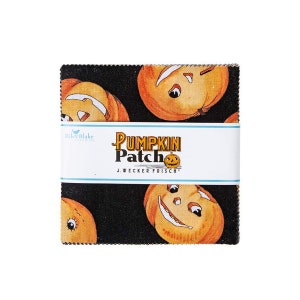May include: A black fabric with a repeating pattern of orange and yellow jack-o'-lantern faces. The fabric has a white label that reads "Pumpkin Patch" and "J. Wecker Frisch".