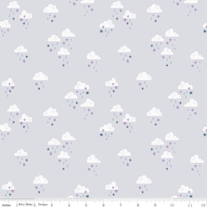 May include: A light gray fabric with a repeating pattern of white clouds, purple and blue stars, and gray raindrops. The clouds are puffy and stylized, with the stars and raindrops falling from them. The design is whimsical and suitable for children's items.