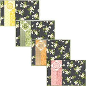 May include: Four placemats with a floral pattern and a geometric design in the center. The placemats are in shades of yellow, orange, green, and pink.