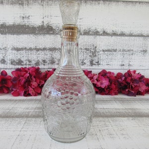 Decorative Wine Bottle with Intricate Grape and Leaf Embossing