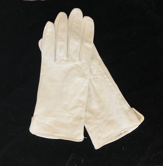 White leather gloves