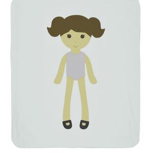 May include: A light blue baby blanket with a cartoon illustration of a girl with brown hair, a purple leotard, and black shoes.