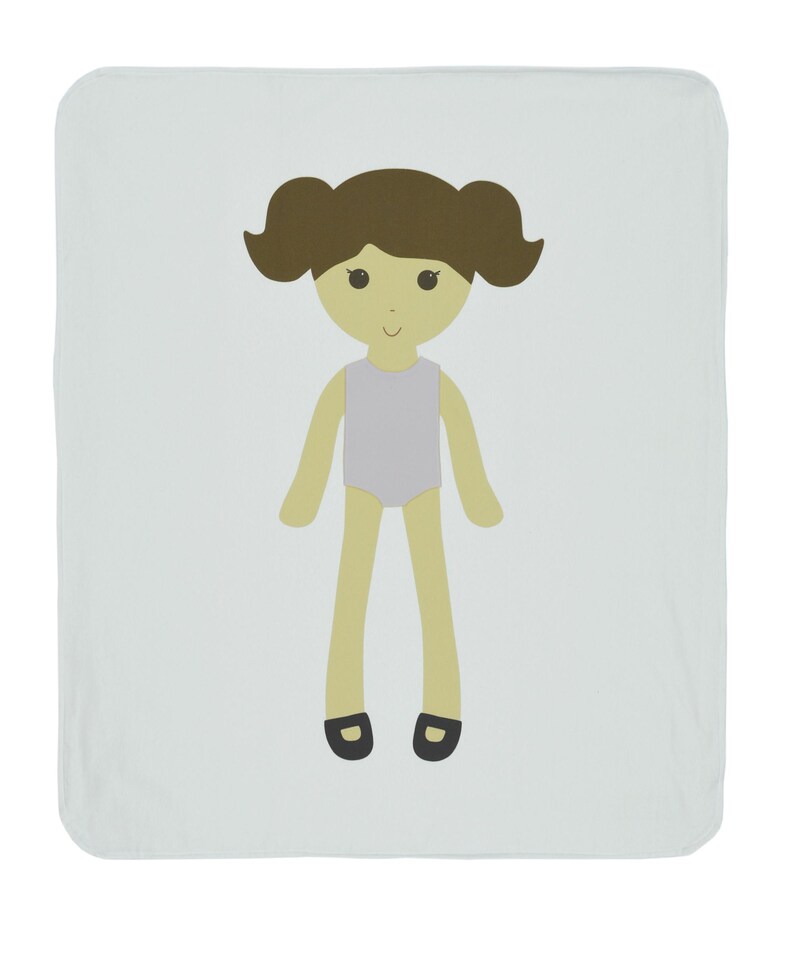 May include: A light blue baby blanket with a cartoon illustration of a girl with brown hair, a purple leotard, and black shoes.
