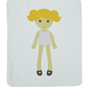 May include: A light blue baby blanket with a cartoon illustration of a girl with yellow hair, a white dress, and black shoes.
