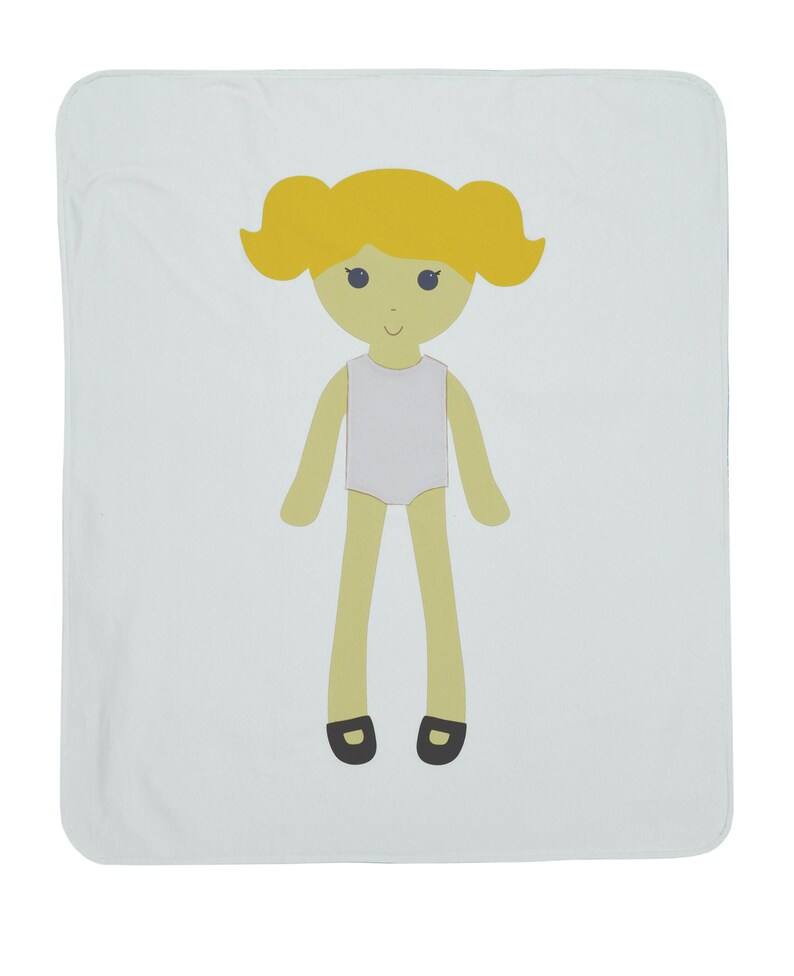 May include: A light blue baby blanket with a cartoon illustration of a girl with yellow hair, a white dress, and black shoes.