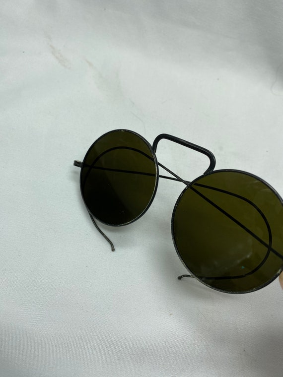 Vintage green glass round wire rimmed sunglasses.