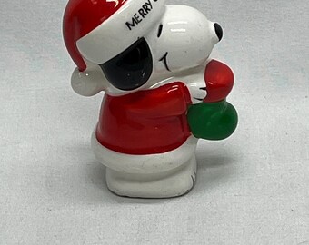 Vintage Snoopy Christmas ornament from the Peanuts collection ,Snoopy with a red Santa suit.