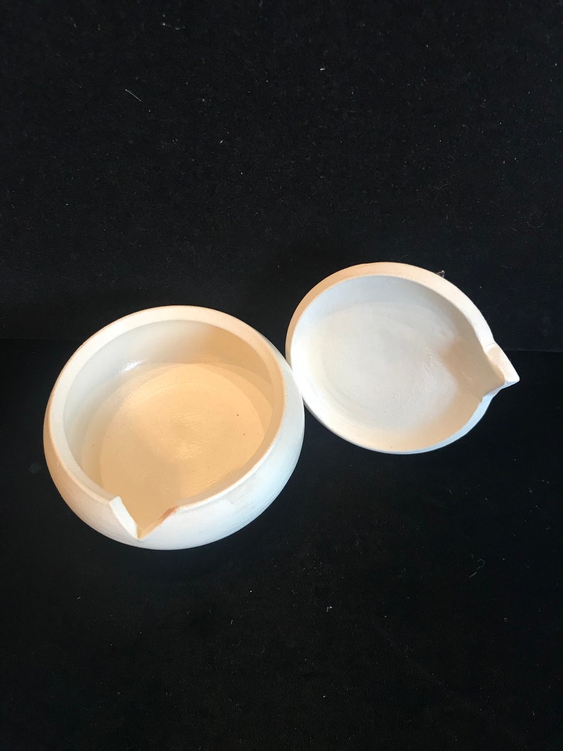 adorable 3-D seals on top. Pottery trinket jar with lid