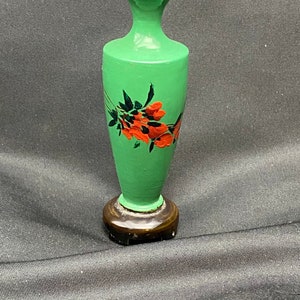 Miniature green wooden hand-painted vase made in China.