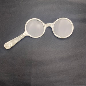 Vintage Folding faux mother of pearl reading glasses.