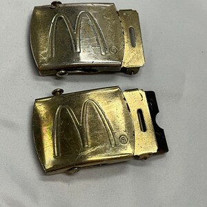 vintage McDonald’s restaurant advertising/uniform belt buckles.