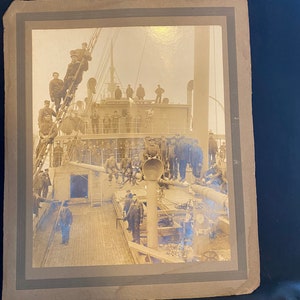 Antique photograph of a group of New England ship builders on board a ship