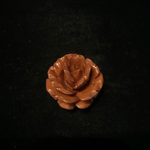 Vintage Carved bakelite rose brooch.