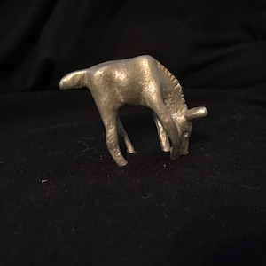 Small pewter deer figurine.
