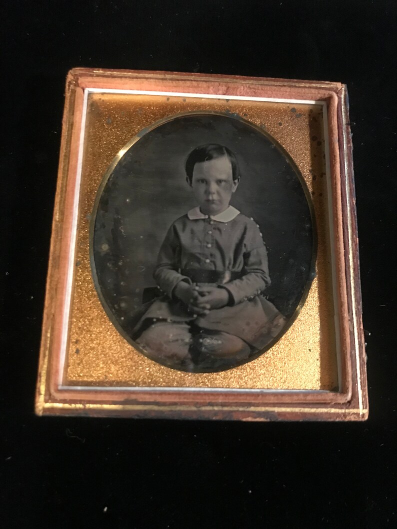 identified in pencil on the inside of case. 16 th plate daguerreotype of a young boy