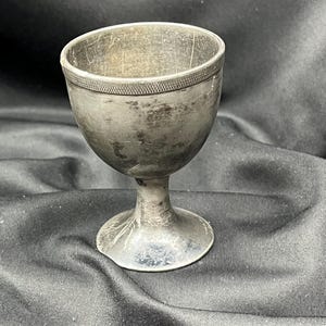 Antique metal egg cup