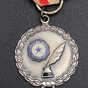 Sterling silver medal American legion auxiliary .