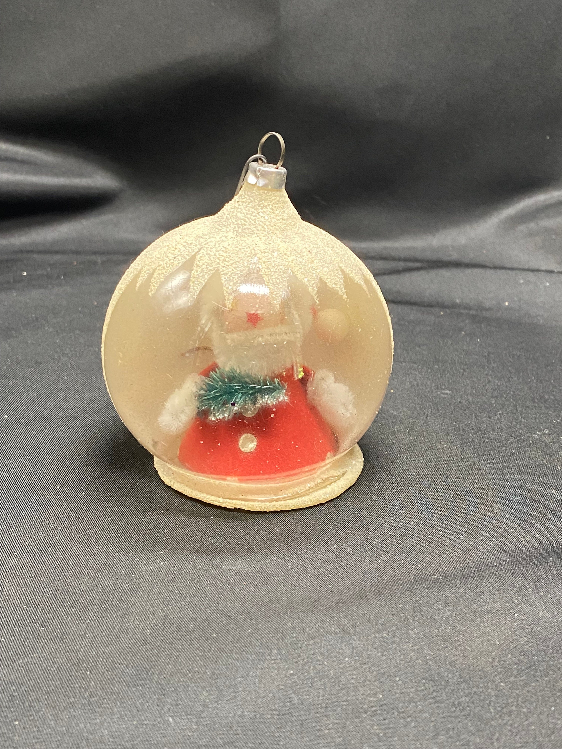 Vintage glass Santa globe ornament.