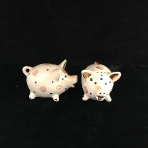 Vintage salt and pepper porcelain pigs hand painted.