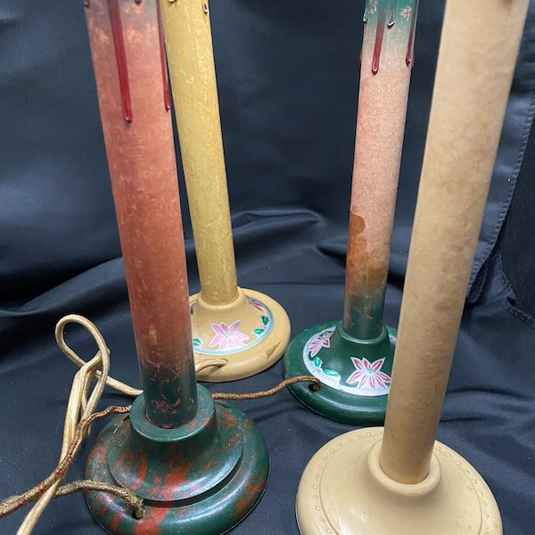 Four vintage electric window Bakelite Christmas candle sticks.