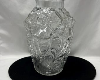 Pressed glass vase with high relief poppie decorations.