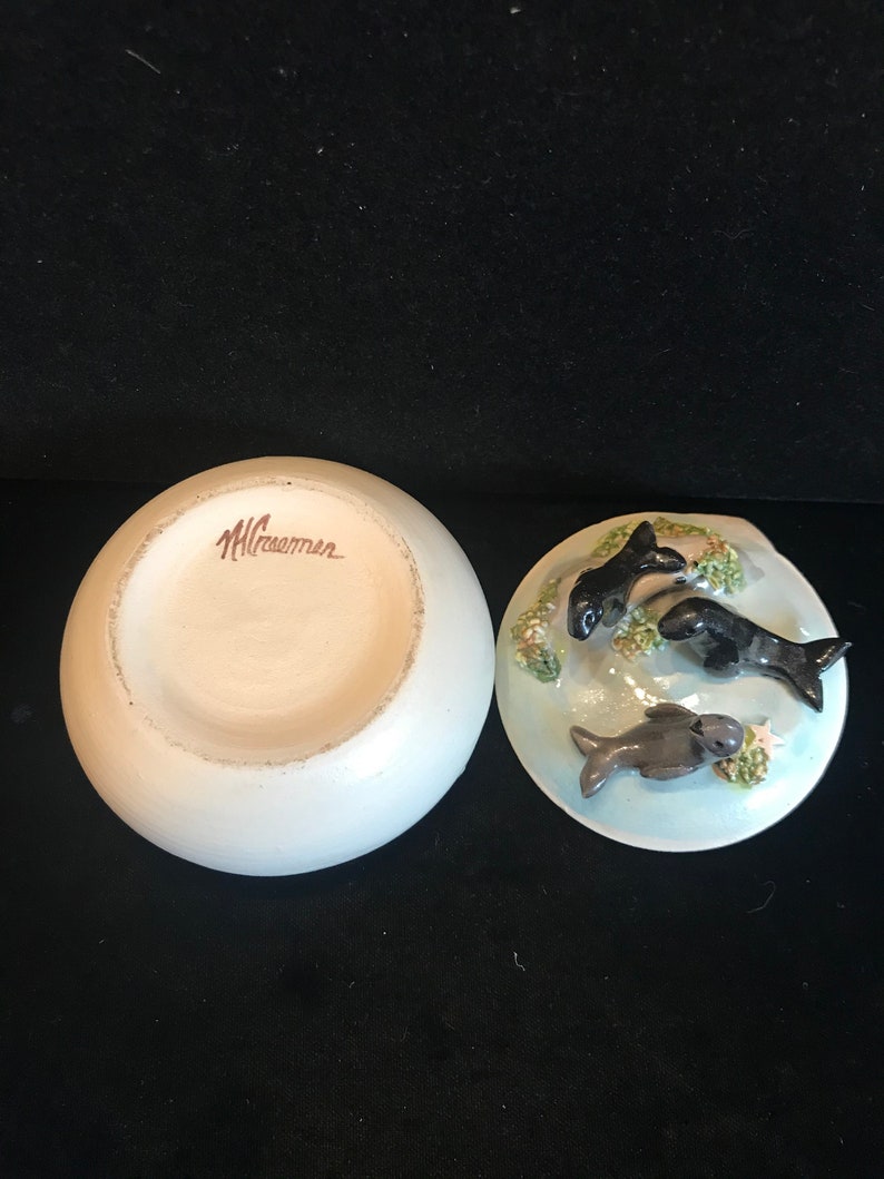 adorable 3-D seals on top. Pottery trinket jar with lid