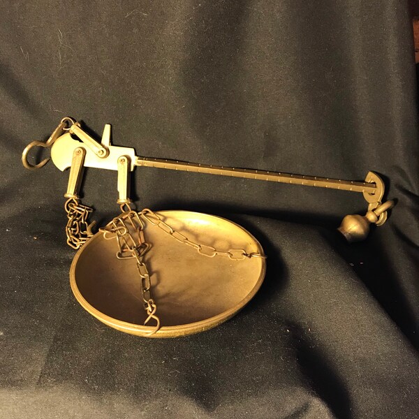 Vintage brass scale with weights and tray.