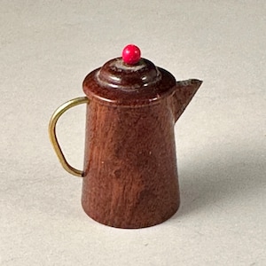 May include: A set of three ceramic mugs with a speckled, matte finish. The mugs are in shades of cream, light gray, and dark gray. Each mug has a simple, minimalist design and a rounded handle. The mugs are suitable for coffee, tea, or other beverages.