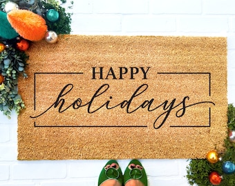 May include: A brown coir doormat with the text "HAPPY holidays" in black lettering.