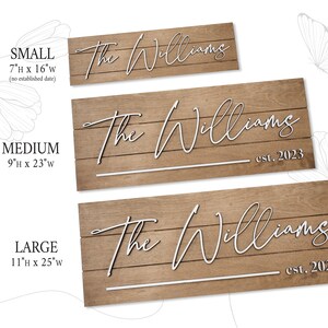 May include: Three wooden signs with the text "The Williams" in white script. The signs are available in three sizes: small (7 inches high by 16 inches wide), medium (9 inches high by 23 inches wide), and large (11 inches high by 25 inches wide). The medium and large signs also include the text "est. 2023".