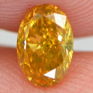 Oval Cut Diamond Fancy Orange Yellow Color 0.53 Carat VS1