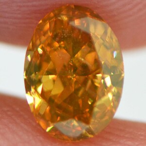 Oval Cut Diamond Fancy Orange Yellow 0.56 Carat VS2