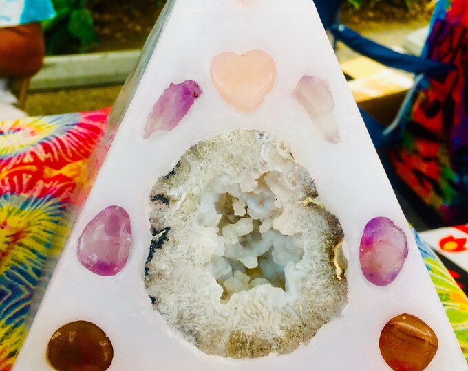 Large White Purifying Crystal Pyramid Candle with inlaid Geodes, Crystals and Gemstones that illuminate when lit! Burns for 250 hours