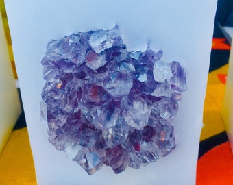 White or Black Chub Square Candle with an inlaid Amethyst Crystal Cluster that illuminates when lit! Burns for 175  hours