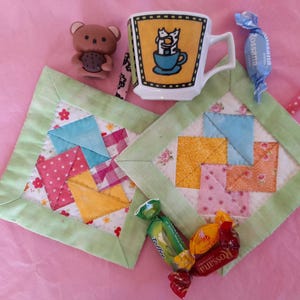 set of two quilted coasters/patchwork coasters"card trick"/mini quilt pastel/patchwork mini hotholders/quilted "card trick" pattern coasters