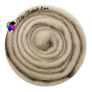 May include: A circular bundle of light brown wool roving, tightly coiled. The text "The Felted Ewe" is arched across the top, with a colorful sheep logo on the left. The wool has a soft, textured appearance.