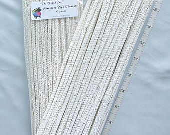 May include: A package of white pipe cleaners, also known as chenille stems, with a label that reads "The Felted Ewe Amigurumi Pipe Cleaners 50 Pieces".