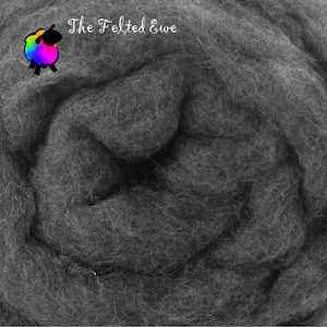 May include: A close-up of dark gray wool roving. The wool is tightly packed and has a soft, textured appearance. The text "The Felted Ewe" is in the upper left corner, along with a colorful sheep logo.