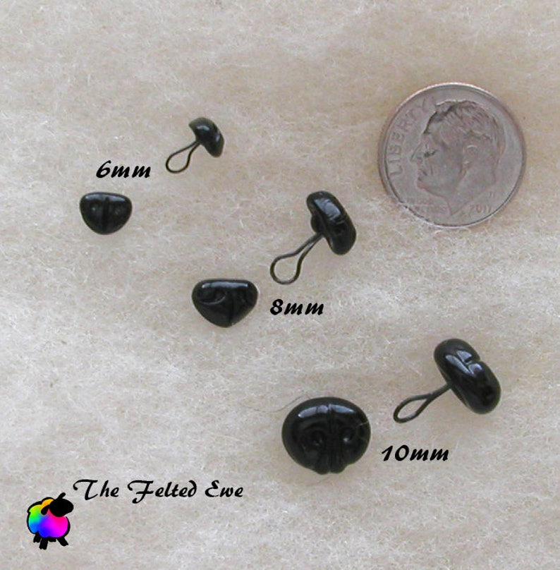 Solid black, smooth, shiny Glass Noses with metal looped backs. Available in the very rare 6mm size as well as 8mm & 10mm. Sold in packets containing 5 Unmatched. For those of you not familiar with the term "Unmatched", all this means is that size may vary slightly from nose to nose but will not vary enough to place it in another size category. This is the norm for these noses.