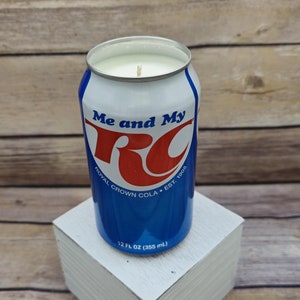 May include: A blue and red can candle with the text "Me and My RC Royal Crown Cola Est. 1905" and "12 FL OZ (355 ml)".