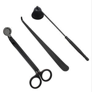 May include: A set of three black candle care tools: a snuffer, a wick trimmer, and a pair of wick scissors.