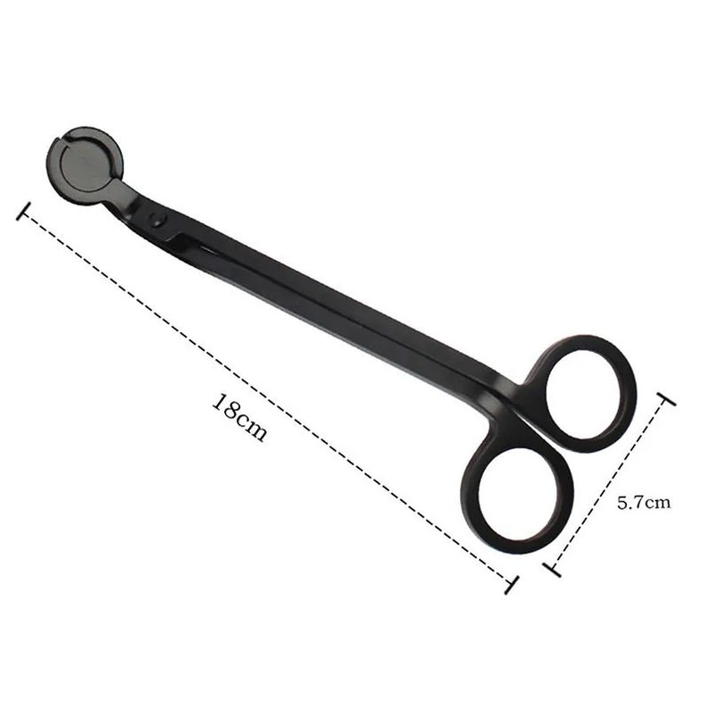 May include: Black metal candle wick trimmer with a round handle and two loops. The trimmer is 18 cm long and 5.7 cm wide.
