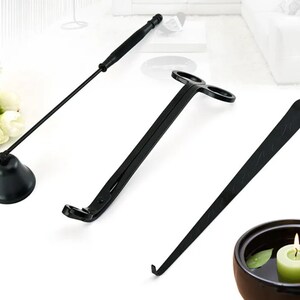 May include: A set of three black candle tools for trimming and extinguishing candles. The tools include a candle snuffer, a wick trimmer, and a wick dipper.