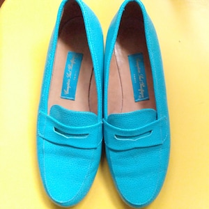 May include: A rustic wooden sign with the text "Welcome to our home" in white lettering. The sign features a distressed finish and a simple, inviting design, perfect for entryway decor.