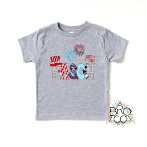 May include: A gray t-shirt with a red, white, and blue design that says "MASON" with fireworks and American flags.