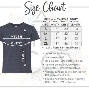 May include: A navy blue youth unisex short sleeve t-shirt with a size chart. The chart lists measurements in inches for width, chest, and length for sizes S, M, L, and XL. The chart also lists fabric details.