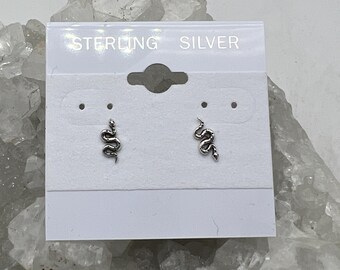 May include: Sterling silver snake earrings on a white card with the text "Sterling Silver".