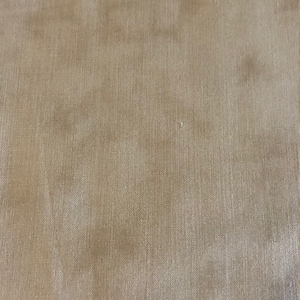 May include: A close-up of a beige fabric with a subtle woven texture.