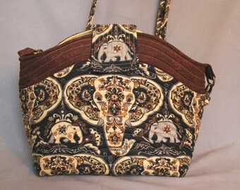 Designer bag with Elephant design Adjustable straps roomy outside and inside pockets tan, brown