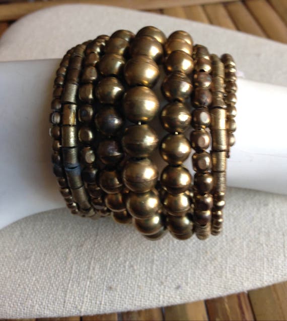 20% offNew Price  8 Row Gold Wrap Bracelet